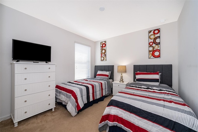 bedroom featuring light carpet