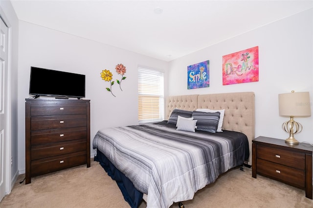 bedroom with light carpet