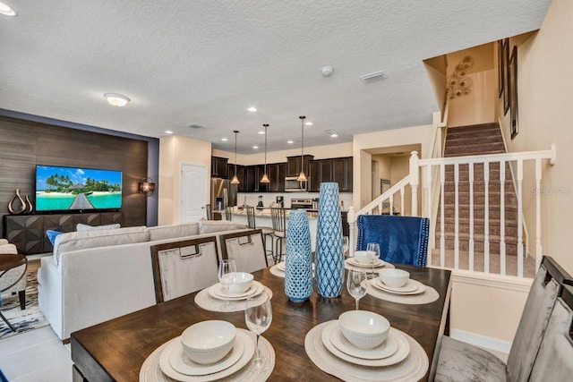 dining area with a textured ceiling