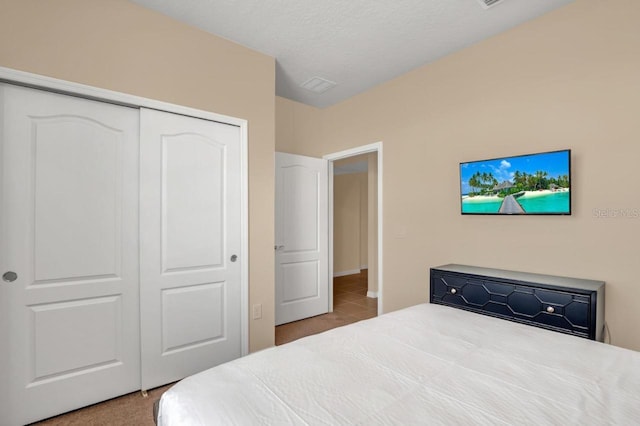 tiled bedroom featuring a closet