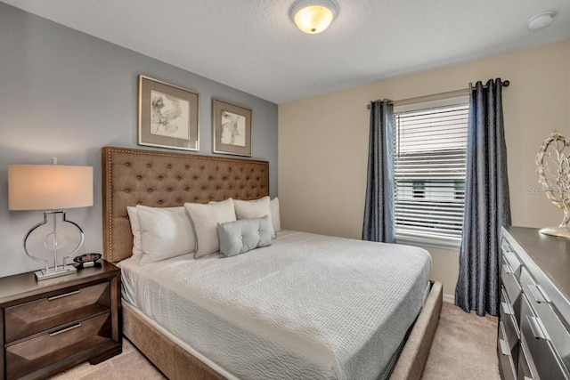 bedroom featuring light colored carpet