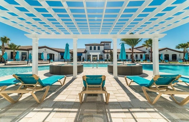 view of patio / terrace featuring a pergola and a community pool