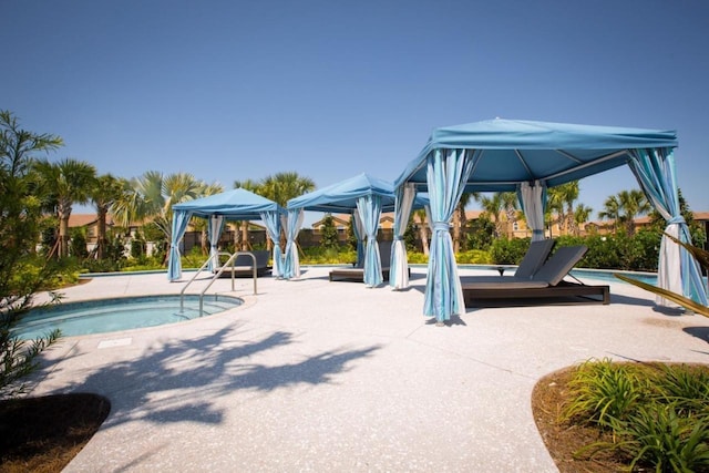 view of playground featuring a patio area and a pool