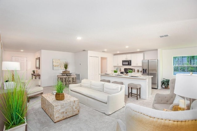 living room with light colored carpet