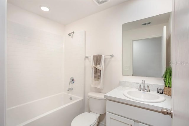 full bathroom with vanity, toilet, and washtub / shower combination