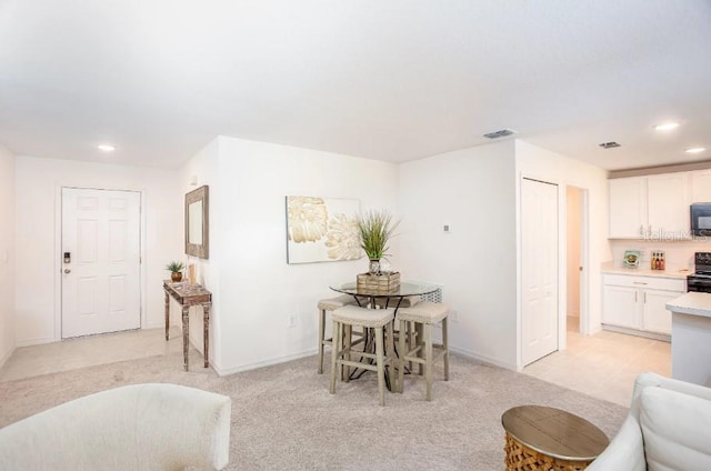 view of carpeted dining area