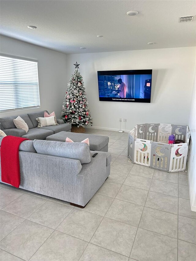 living room featuring light tile flooring