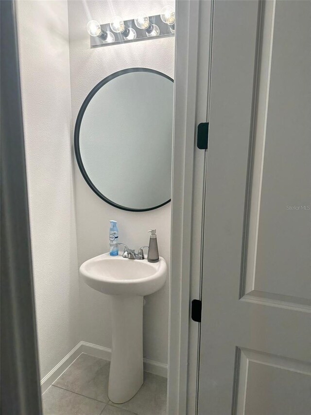 bathroom with tile flooring