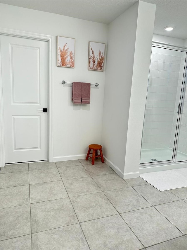 hallway featuring light tile floors