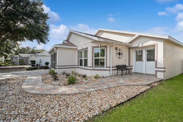 back of property featuring a patio