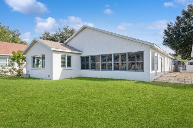 back of house featuring a yard