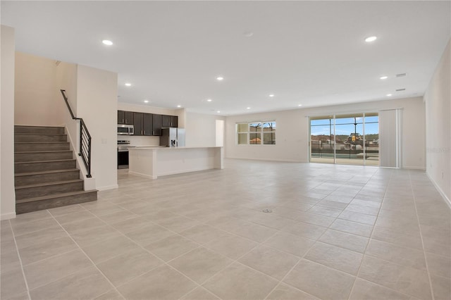 unfurnished living room with light tile floors