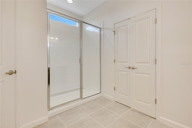 bathroom featuring tile floors and walk in shower