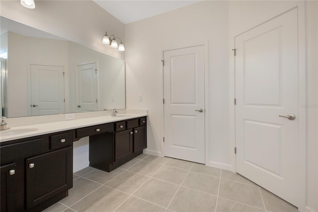 bathroom with double sink, tile floors, and vanity with extensive cabinet space