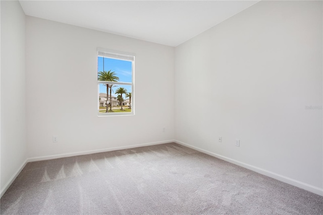 unfurnished room with light carpet