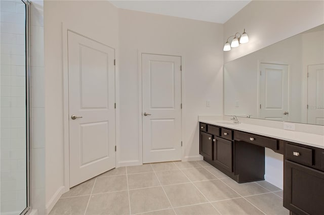 bathroom featuring tile floors and vanity