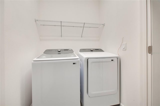 washroom featuring washer and dryer