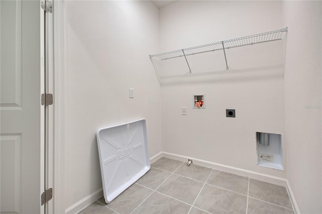 laundry area with electric dryer hookup, hookup for a gas dryer, light tile flooring, and hookup for a washing machine