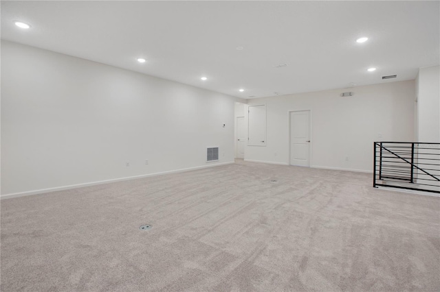 unfurnished room with light carpet