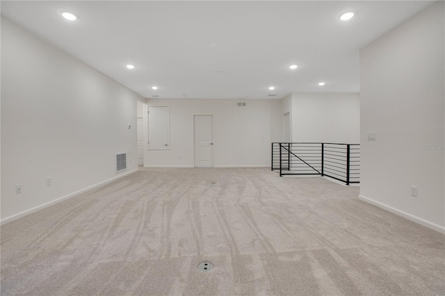 spare room with light colored carpet