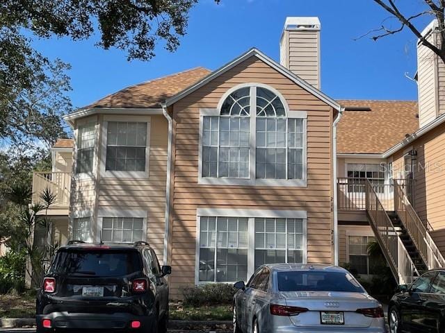 view of front of home featuring a balcony