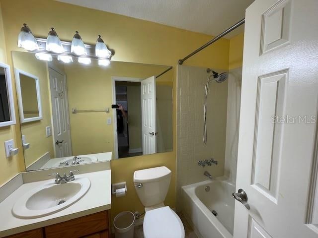 full bathroom featuring vanity, toilet, and bathing tub / shower combination