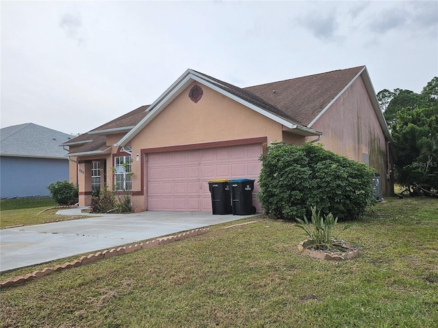 view of front facade with a garage and a front yard