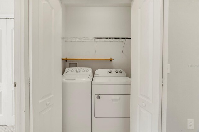 laundry room with separate washer and dryer