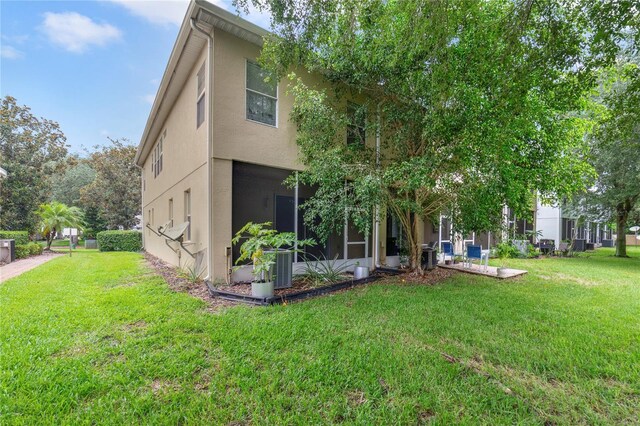 rear view of house with a yard