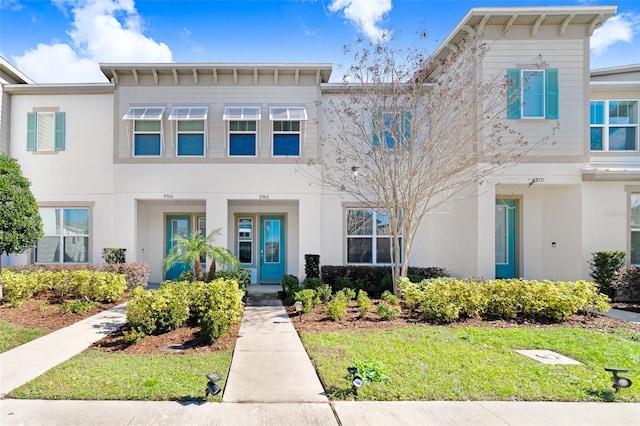 view of property featuring a front yard