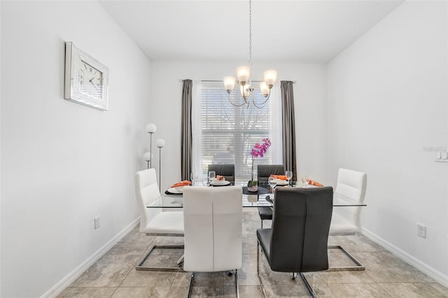 dining room with light tile flooring and a notable chandelier