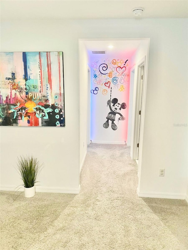 hallway with light colored carpet