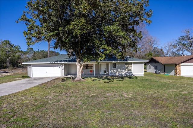 ranch-style house featuring a garage, a front lawn, and a porch