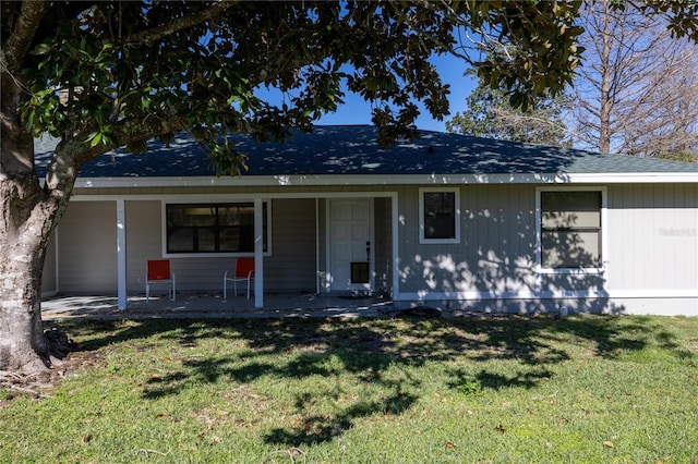 view of front of house featuring a front yard and a porch