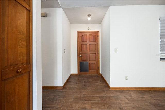 corridor featuring dark hardwood / wood-style flooring