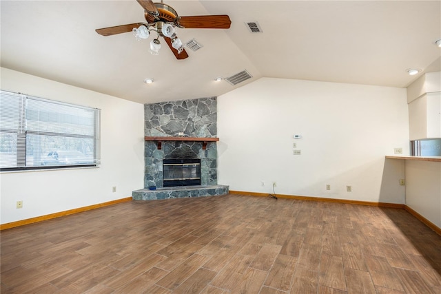 unfurnished living room with vaulted ceiling, ceiling fan, hardwood / wood-style flooring, and a fireplace