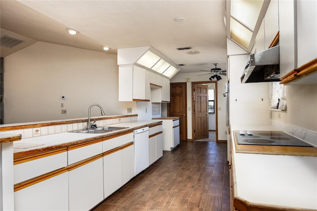 kitchen featuring dark wood-type flooring, ceiling fan, wall chimney exhaust hood, and white cabinetry