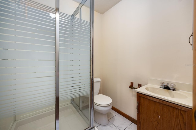 bathroom with toilet, vanity, a shower with door, and tile flooring