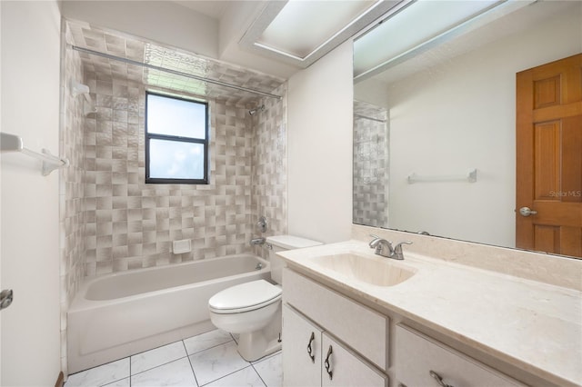 full bathroom with tiled shower / bath, toilet, tile floors, and vanity