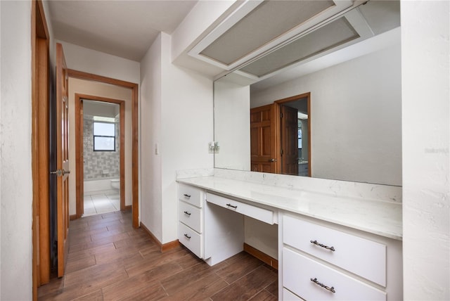 bathroom featuring tile flooring and vanity