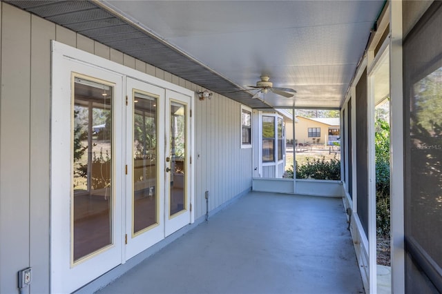 unfurnished sunroom featuring plenty of natural light and ceiling fan