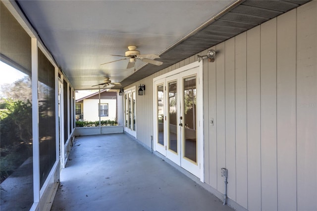 unfurnished sunroom featuring french doors and ceiling fan