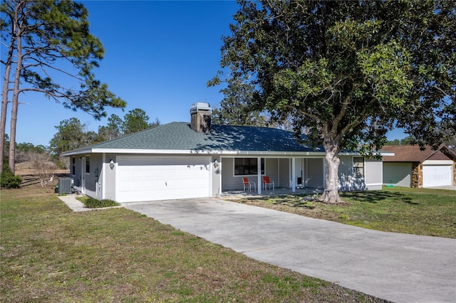 single story home featuring a garage, central AC unit, covered porch, and a front yard