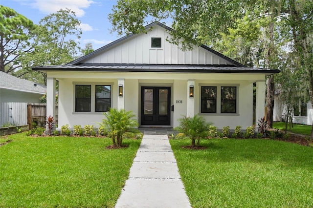 view of front of home with a porch and a front yard