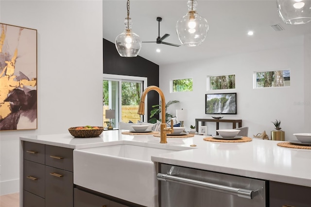 kitchen with dishwasher, hanging light fixtures, lofted ceiling, and sink