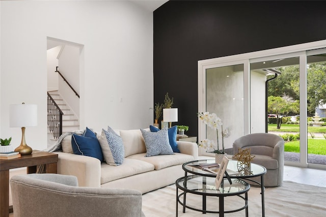 living room featuring a high ceiling