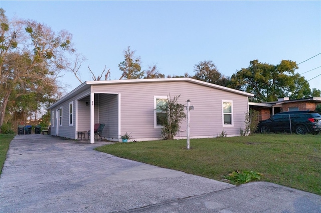 rear view of house featuring a yard