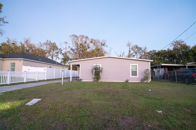 back of property featuring a lawn