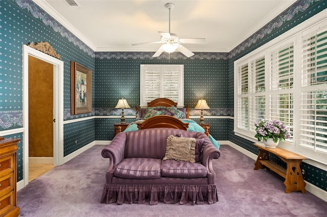 carpeted bedroom with ceiling fan and crown molding