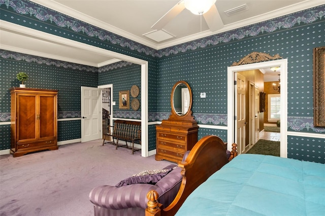 carpeted bedroom featuring ceiling fan and ornamental molding